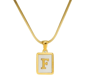 Macro shot of 18K gold plated square shell pendant featuring engraved letter F on chain