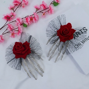 Gothic Halloween hair clips featuring red roses and skeleton hands with black lace detail