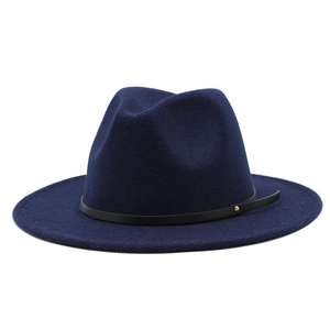 Detailed view of navy blue wool fedora hat with black leather band and metal rivet