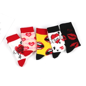 Detailed flat lay of five cotton socks featuring Valentine heart and lip patterns