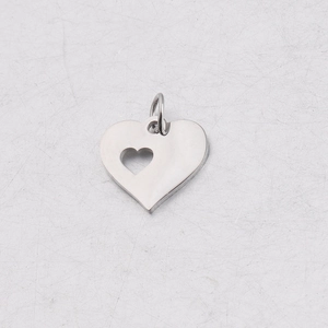 Macro detail of silver stainless steel double heart pendant with cutout and jump ring