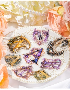 Baroque style floral letter PET stickers displayed on vintage plate with pearls