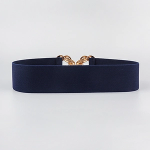 Detail of navy blue elastic woven belt featuring a polished gold metal chain buckle