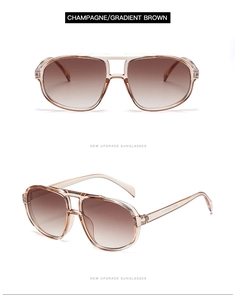 Detail view of champagne pilot sunglasses with gradient brown lenses and double bridge