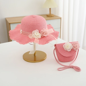 Pink straw hat and matching bag set with 3D floral accents for kids summer sun protection