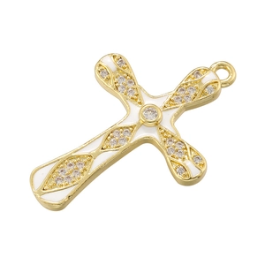 Detailed close-up of golden copper cross pendant with white enamel and clear zircons