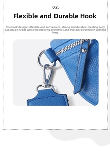 Detail of blue pebbled leather bag with a durable silver metal lobster clasp and zipper