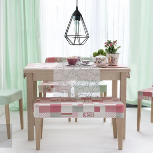 Detail of pink and grey floral patchwork dining bench cover and chair protectors