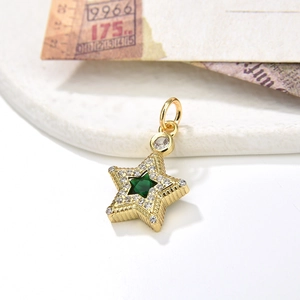 Chunky gold star pendant necklace with emerald green stone and micro-paved zircons