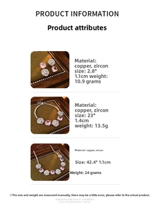 Detailed view of silver flower jewelry set with pink square zircon and rose pattern