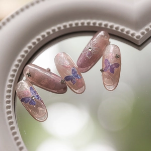 5D butterfly press-on nail set with purple jelly finish and sparkling rhinestones