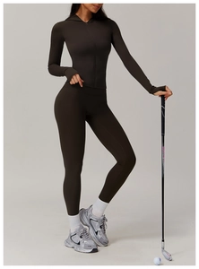 Detail of dark brown zip-up hooded sports jacket and high-stretch yoga leggings set