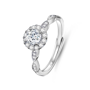 Close-up of a silver Moissanite engagement ring with a halo setting on a white background