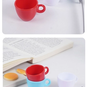 Detailed view of colorful miniature coffee cups and macaron play food accessories