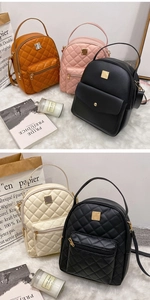 Close-up of quilted PU leather mini backpacks in multiple colors with metal buckles