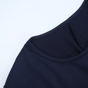 Detail of a navy blue long-sleeve dress neckline showing fine knit fabric and dual stitching