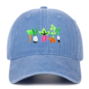 Detailed close-up of vibrant vegetable embroidery on vintage washed blue cotton baseball cap