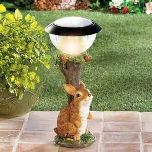 Solar powered garden welcome light featuring a resin rabbit sculpture and warm LED glow