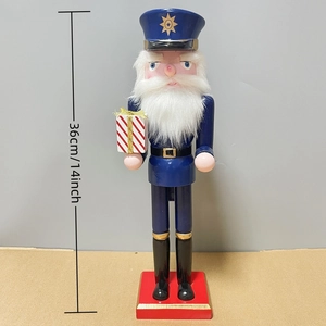 36cm Nutcracker soldier figurine in dark blue uniform holding a striped gift box