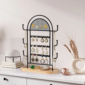Black metal arched mesh jewelry organizer with wooden base for earrings and necklaces