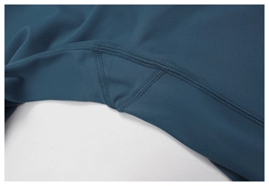 Detail of high-waist yoga pants featuring reinforced gusset and flatlock stitching