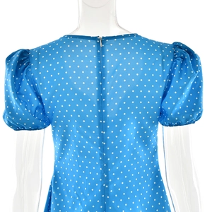 Detail of blue polka dot dress back with invisible zipper and retro puff sleeves