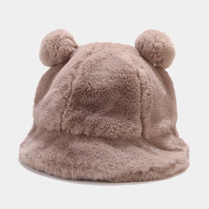 Close-up of soft taupe faux rabbit fur texture on a warm winter bucket hat with ears