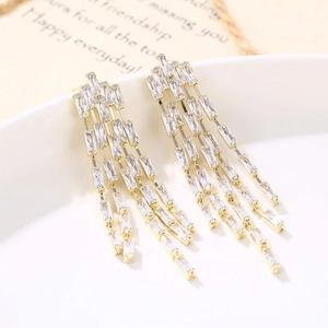 Exaggerated golden tassel drop earrings with sparkling cubic zirconia for evening party