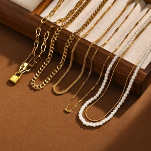 Golden multi-style chain necklace set with pearl and Love engraved padlock pendant