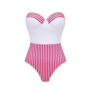 Detail view of a strapless one-piece swimsuit featuring a white top and red striped bottom