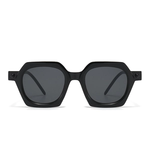 Black geometric polygonal sunglasses with dark grey lenses and stud temple accents