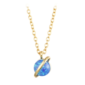 Macro detail of golden planet necklace with blue opal stone and orbital ring