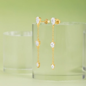 Detailed close-up of S925 sterling silver long tassel earrings with teardrop zircons