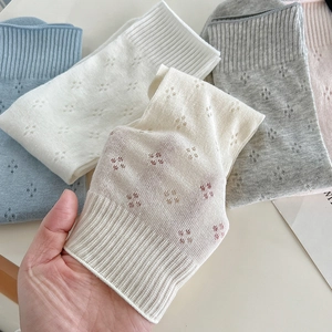 Breathable mesh knit crew socks for women featuring floral hollow patterns in pastel colors