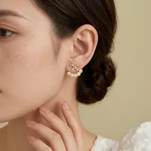 Elegant 18k gold plated bowknot earrings with five white pearls for a vintage look