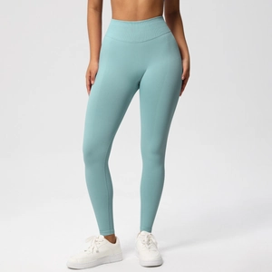 Detail view of high waisted seamless yoga leggings in mint green with ribbed waistband