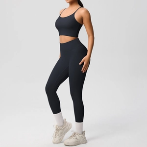 Side view of black high-waisted yoga set featuring sports bra and slim leggings