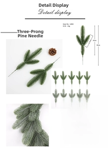 Macro shot of artificial pine needles showing realistic texture and 26cm branch dimensions