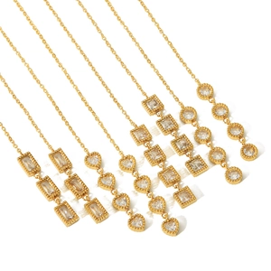 Elegant gold drop earrings with tiered geometric crystals including heart and square shapes