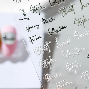 3D relief nail art stickers with black and white cursive text and smooth gradient finish