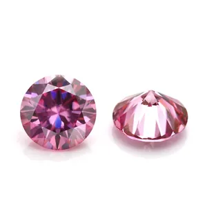 Macro view of round brilliant cut pink moissanite stones showing crown and pavilion details