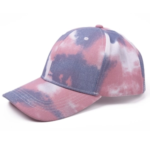 Detail of a tie-dye baseball cap with pink and purple gradient patterns for sunshade