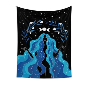 Detail of bohemian tapestry featuring blue hair goddess with moon phases and stars decor