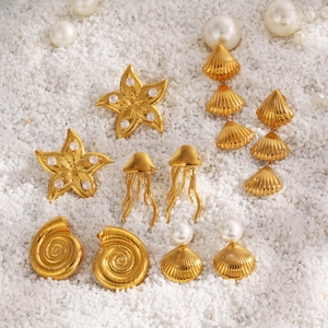 Golden starfish and seashell earrings set with pearls and zircons for beach vacations