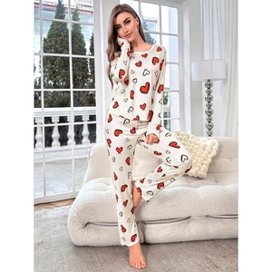 Women's two-piece heart print pajamas set with long sleeve top and elastic pants