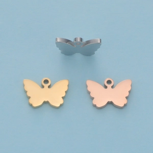 Set of three butterfly pendants in silver, gold, and rose gold mirror polished steel
