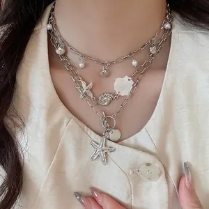 Bohemian multi-layer silver necklace with shell, starfish pendants and pearls