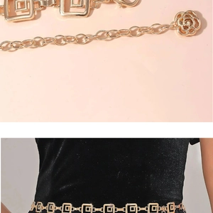 Detail of gold metal waist chain featuring square links and an elegant rose pendant