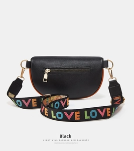 Detailed back view of black lychee leather waist bag with gold zipper and LOVE strap