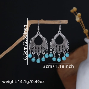 Detailed view of silver bohemian drop earrings with blue beads and size dimensions